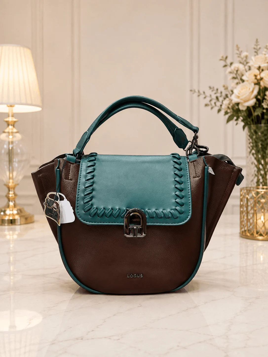 ÉLANORA Premium Brown & Teal Women’s Handbag ÉLANORA premium brown and teal women’s handbag with elegant stitched flap, spacious interior and structured design