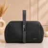 Black structured satchel handbag with secure front lock closure, premium textured PU leather and spacious interior