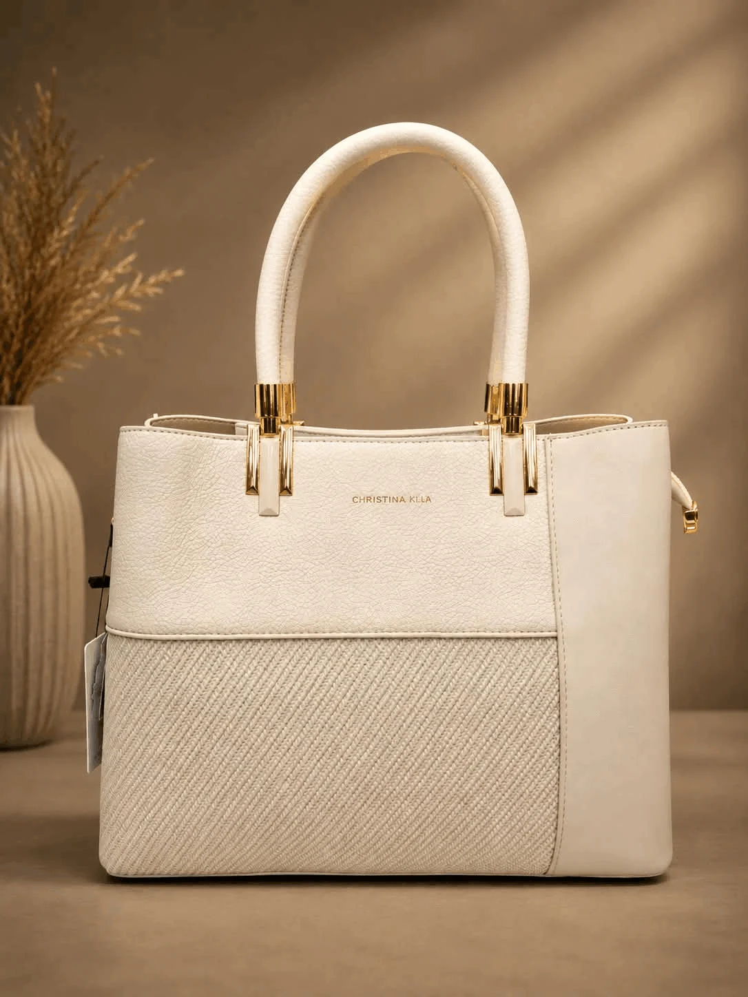 Premium Ivory Textured Top Handle Tote Bag for Women (2) Ivory textured top handle tote bag for women with an elegant structured design, stylish patterned front panel and premium gold-tone hardware.