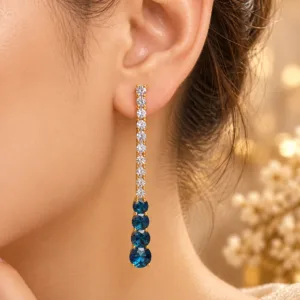 18K gold plated blue stone drop earrings with sparkling clear stones and an elegant elongated design