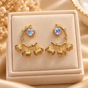 Gold plated floral drop earrings with iridescent stone and textured floral charms