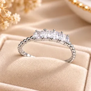 Silver tone beaded ring with sparkling rectangular clear stones