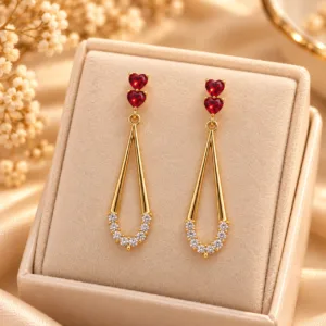 Red heart drop earrings with clear stones and polished gold tone finish