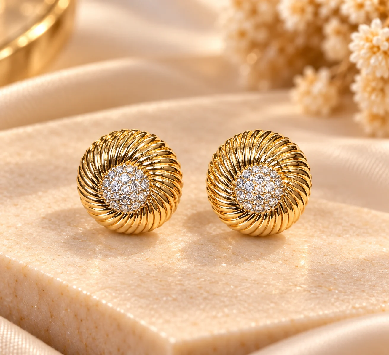 Elegant 18K Gold Plated Zirconia Earrings (4) Elegant 18K Gold Plated Zirconia Earrings with round ribbed design and sparkling centre cluster