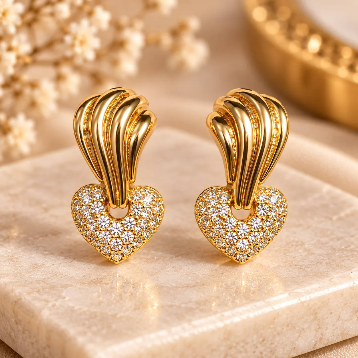 Elegant 18K Gold Plated Zirconia Heart Earrings (6) Elegant 18K Gold Plated Zirconia Heart Earrings with sculpted curved design and sparkling heart detail