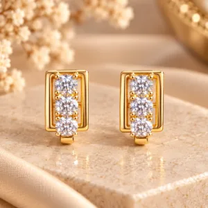 Elegant 18K Gold Plated Zirconia Huggie Earrings with three round stones in a rectangular setting
