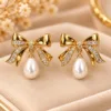 Elegant 18K Gold Plated Zirconia Pearl Earrings with bow design and white pearl drop