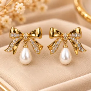 Elegant 18K Gold Plated Zirconia Pearl Earrings with bow design and white pearl drop
