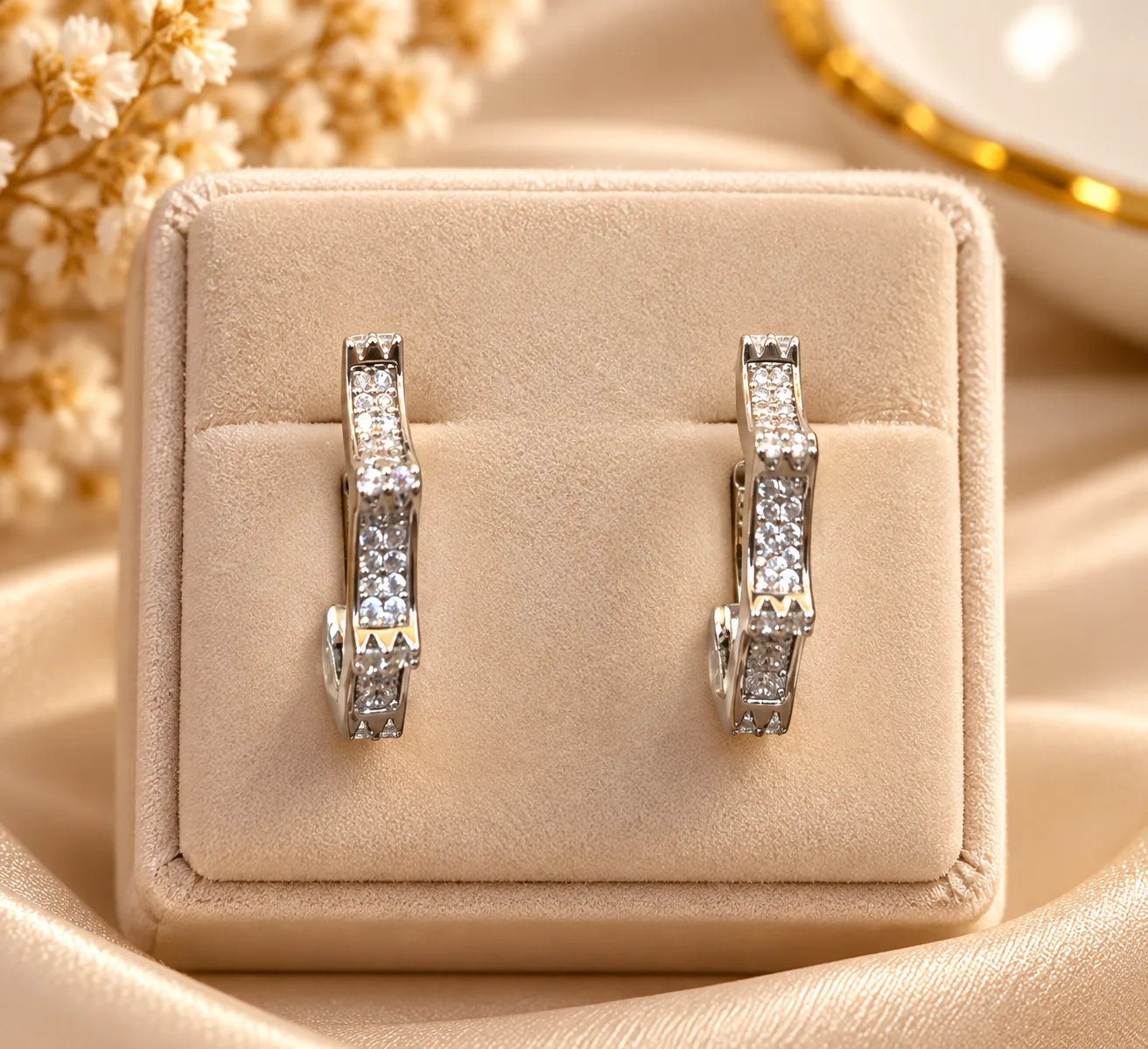 Elegant Silver Plated Hoop Earrings (3) Elegant Silver Plated Hoop Earrings with curved design and clear decorative stone detailing