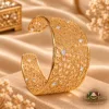 ZUPING 18K Gold Plated Zirconia cuff bracelet worn on a model's wrist