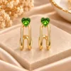 Green heart earrings with polished gold tone linked drop design