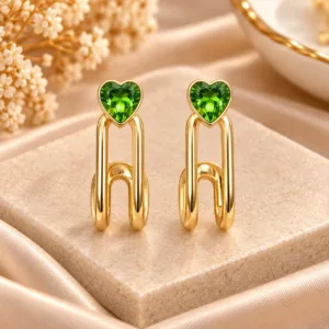 Green heart earrings with polished gold tone linked drop design