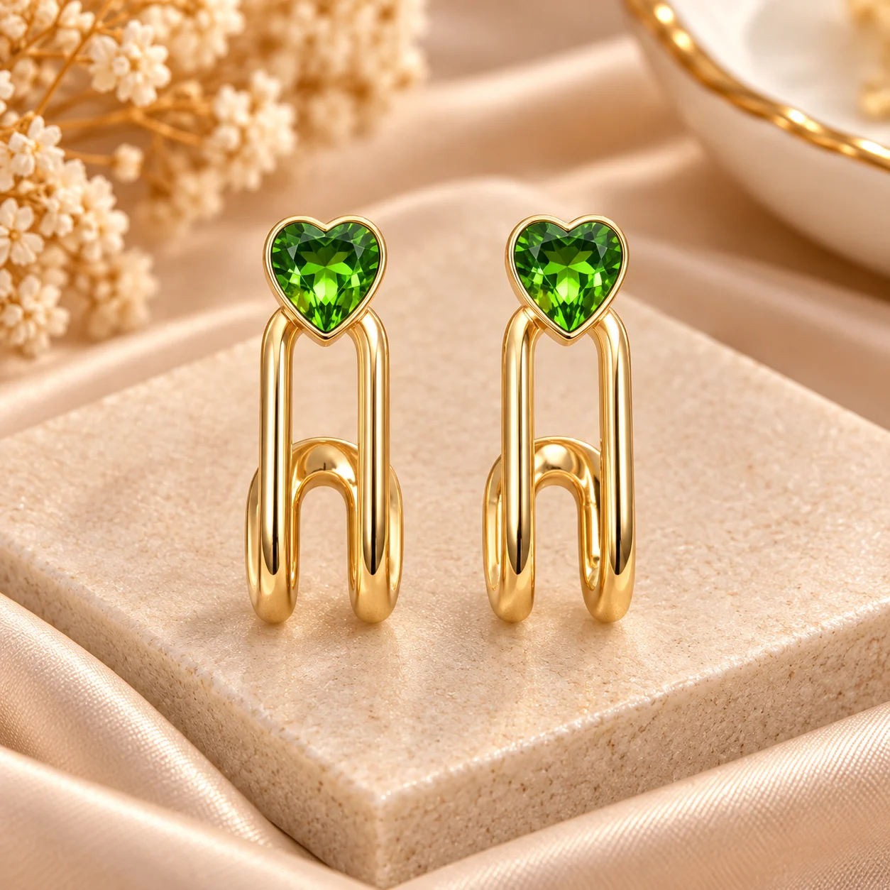 Green Heart Link Earrings (4) Green heart earrings with polished gold tone linked drop design