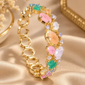 Gold tone stone bracelet with multicolor stones and sparkling clear accents