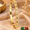 Premium 18K Gold Plated Zirconia Bangle by Zuping with zirconia stone detailing and central circular motif
