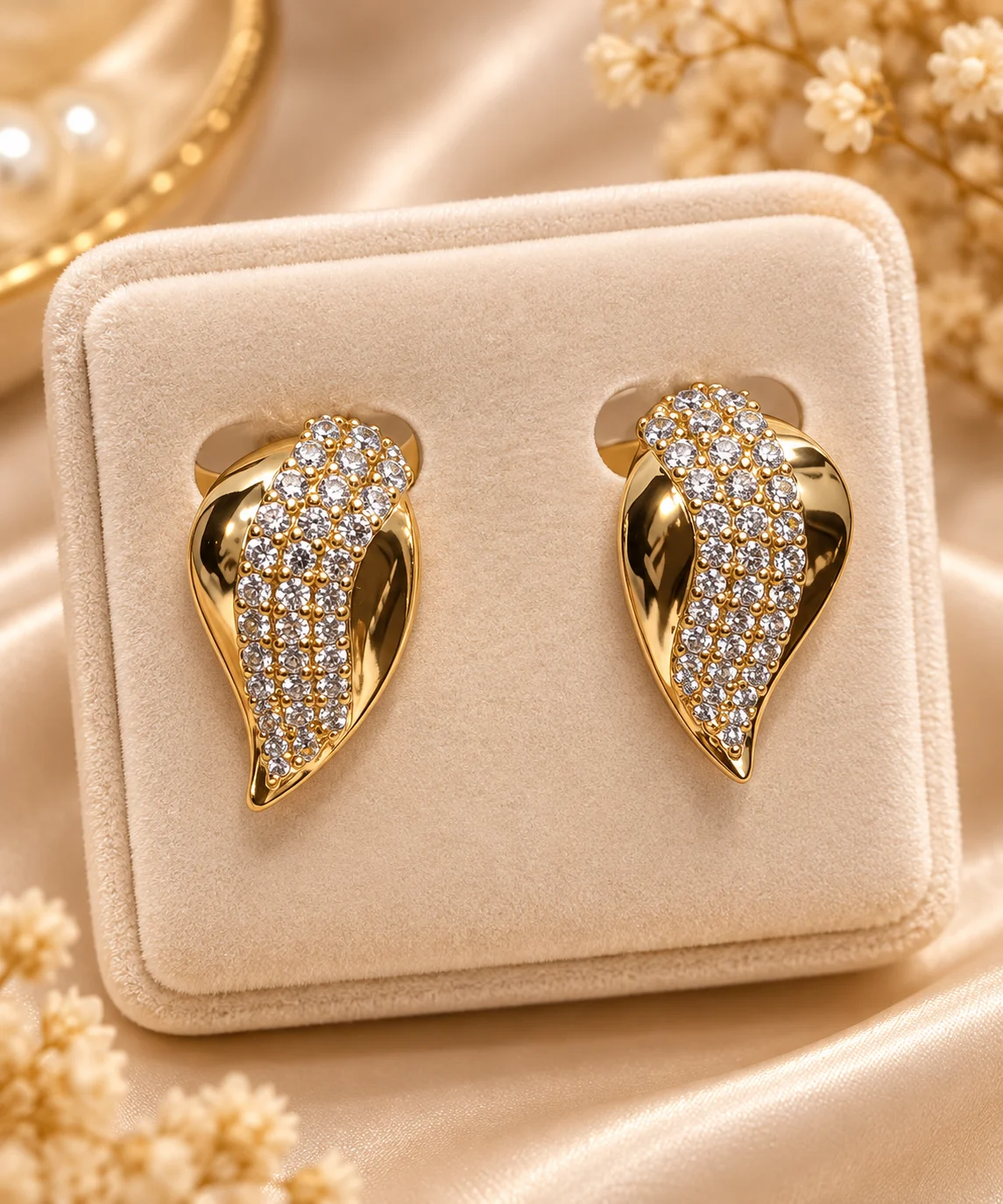 Radiant 18K Gold Plated Leaf Earrings (1) Premium 18K gold plated leaf earrings with sparkling clear stone detailing