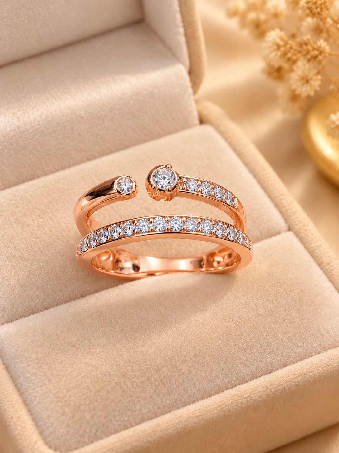 Radiant Rose Tone Open Ring (1) Exquisite rose tone open ring with sparkling clear stones and polished finish