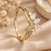 Gold tone floral ring with sparkling clear leaf-shaped stones