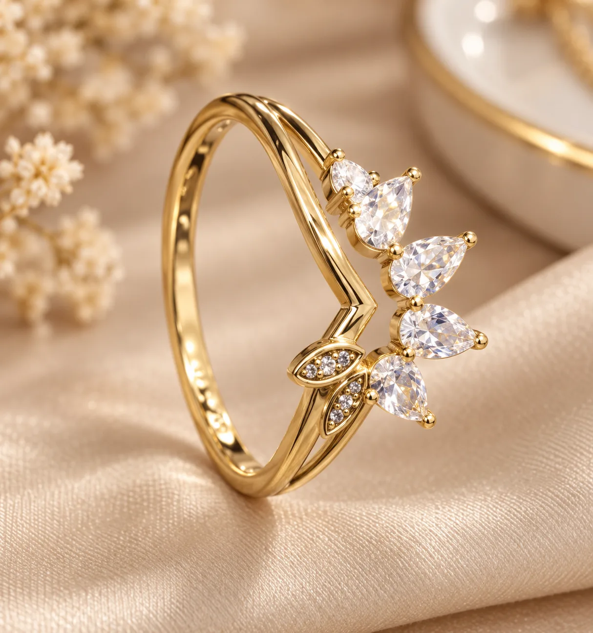 Stunning Bloom Gold Tone Floral Ring (2) Gold tone floral ring with sparkling clear leaf-shaped stones