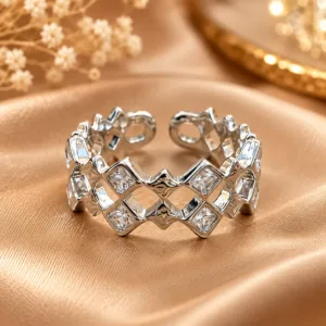 Silver tone geometric statement ring with clear stones and open design