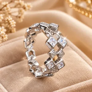Silver tone geometric statement ring with clear stones and open design