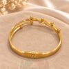Polished Gold Tone Multi-Strand Metal Bracelet