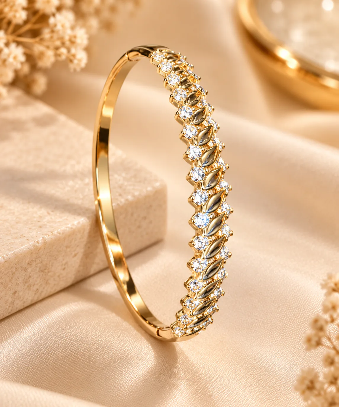 XUPING Leaf Luxe 18K Gold Plated Zirconia KADA Bracelet (3) Elegant 18K Gold Plated Zirconia KADA Bracelet by XUPING with leaf-pattern detailing