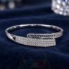 XUPING Silver Tone Crystal Wrap Bangle with asymmetric overlapping ends