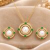 Zirconia pendant set with green crystal beads and matching earrings in gold tone finish