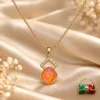 18K Gold Plated Zirconia Pendant Necklace with orange-pink centre stone, geometric zirconia detailing and linked gold-coloured chain.