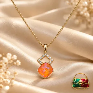 18K Gold Plated Zirconia Pendant Necklace with orange-pink centre stone, geometric zirconia detailing and linked gold-coloured chain.