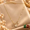 18K Gold Plated Zirconia Star Charm Necklace by Zuping with an open star, a stone-decorated star, a marquise-shaped charm and clear chain accents.